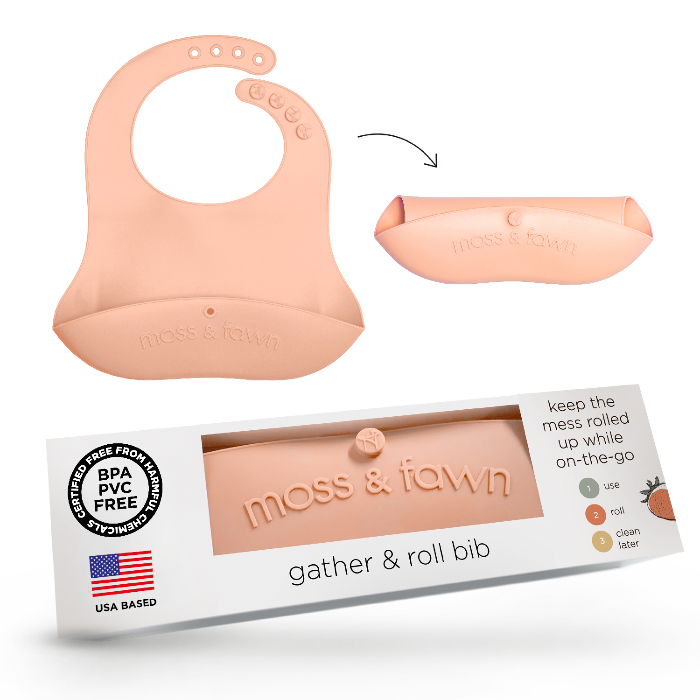 Silicone bib with packaging labeled 'moss & fawn' on a white background
