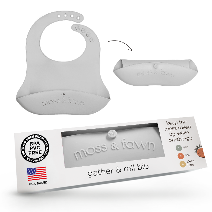 Silicone bib with packaging labeled 'moss & fawn' on a white background