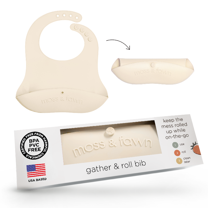 Silicone bib with packaging labeled 'moss & fawn' on a white background