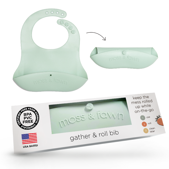 Silicon bib with packaging labeled 'moss & fawn' on a white background
